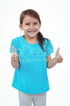 Standing girl showing thumbs to camera