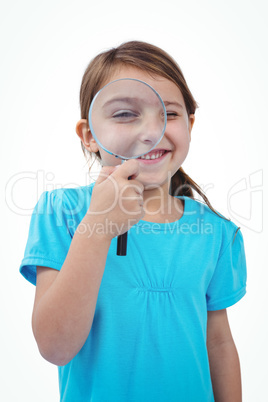 Standing girl using magnifying glass