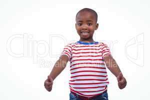 Standing boy showing thumbs to camera