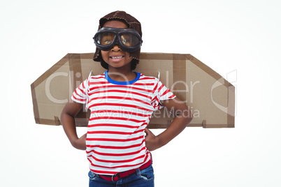 Smiling boy pretending to be pilot