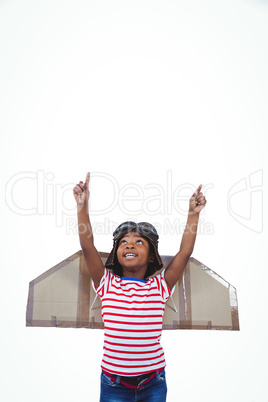 Smiling boy pretending to be pilot