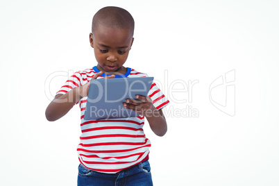 Standing boy using tablet