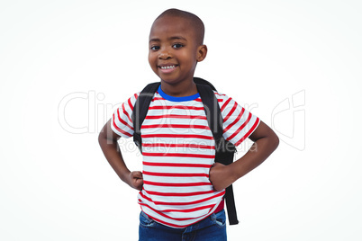 Standing boy with backpack smiling at the camera