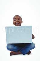 Sitting boy using laptop