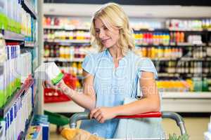 Beautiful woman holding product