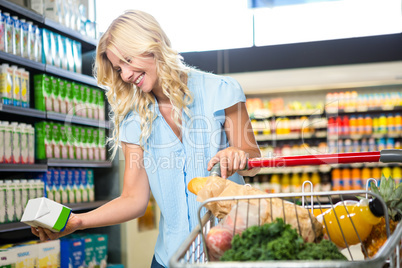 Beautiful woman holding product