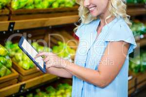 Smiling woman using tablet