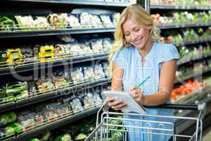 Smiling woman ticking off list