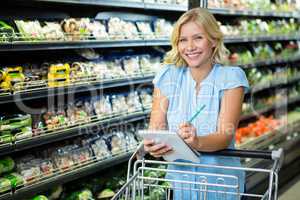 Smiling woman ticking off list