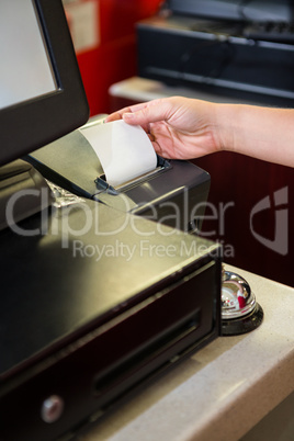 Hand of woman taking receipt