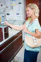 Smiling woman paying with credit card