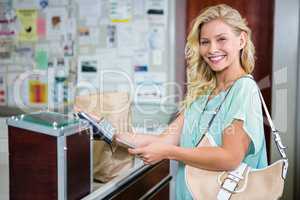 Smiling woman paying with credit card