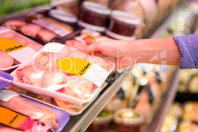 Smiling woman taking meal in the aisle