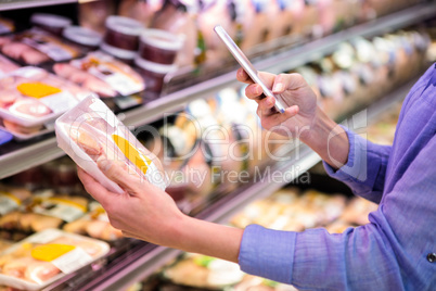 Woman taking picture of some meal