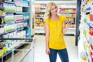 Woman buy products and texting