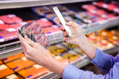 Woman taking picture of some meal