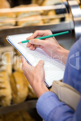 Woman checking her shopping list