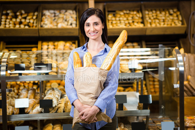 Woman holding bread and credit card