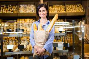 Woman holding bread and credit card