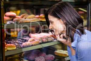 Pretty smiling woman choosing her dessert