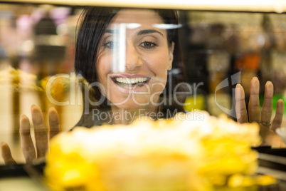 Pretty smiling woman choosing her dessert