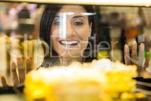 Pretty smiling woman choosing her dessert