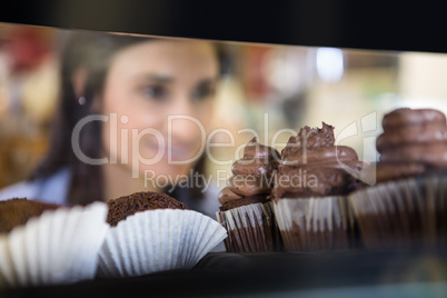 Pretty smiling woman choosing her dessert