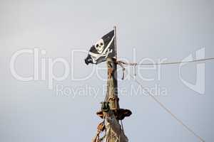 Fragments of a pirate ship Sails of a pirate ship on a background of blue sky