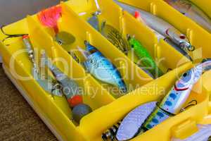Fishing tackle: a set of spoons in the container.