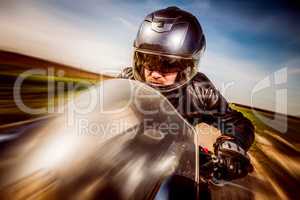 Biker racing on the road