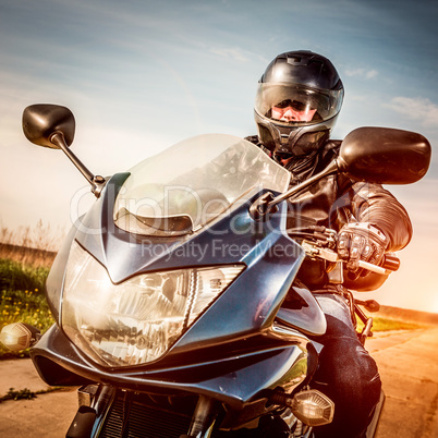 Biker racing on the road