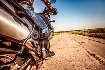 Biker girl riding on a motorcycle