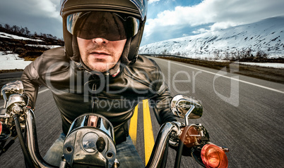 Biker racing on the road