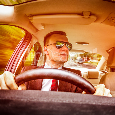 Man driving a car.