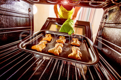 Baking Gingerbread man in the oven