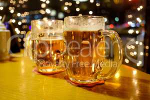 Two cups of beer in a pub