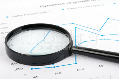 Close up magnifying glass on paper with the schedule