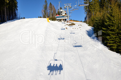 The slope of Bukovel ski resort and shadow, Ukraine