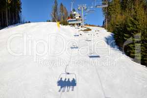 The slope of Bukovel ski resort and shadow, Ukraine