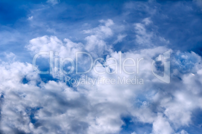 Blue sky and white fluffy clouds.