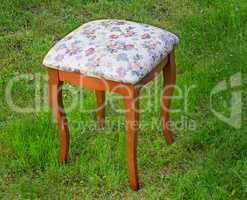 Convenient stool with the seat upholstered with a gobelin.