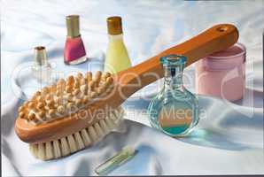 Massage brush and conditioning agents behind a body.