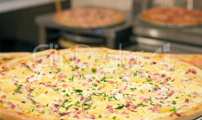 Ham, cheese and parsley greens pizza.