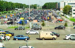 City landscape overlooking a parking of cars.