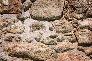 Fragment of an ancient wall from stones. (Background image)