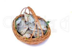 Wattled basket with hooked fish on a white background.