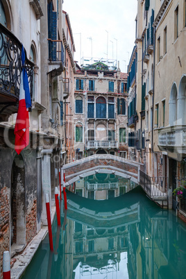 Narrow canal with bridge in Venice