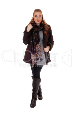 Young woman in jacket and boots.