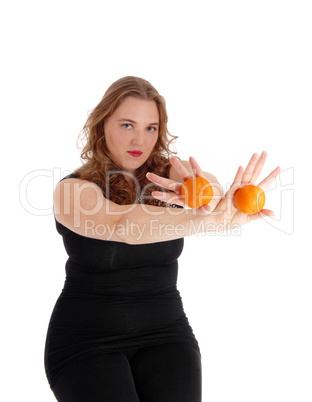 Woman holding two oranges. Woman holding two oranges.