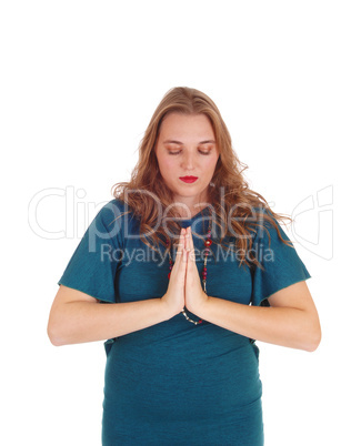 Praying young woman.